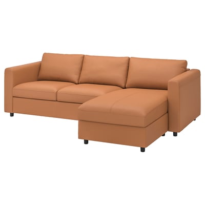 Brown leather l-shaped sofa, 2-seater, chaise section. Modern, clean design, black legs.