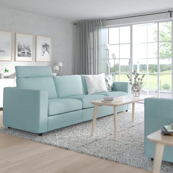Modern living room with VIMLE light blue sofa, large cushions, and minimalist decor.