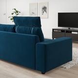 Blue VIMLE sofa in modern living room. Placed against white wall, near tv.