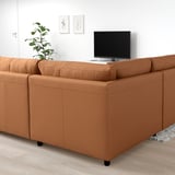 Modern orange VIMLE sofa in minimalist design. Large, spacious, with soft leather and fabric seating.