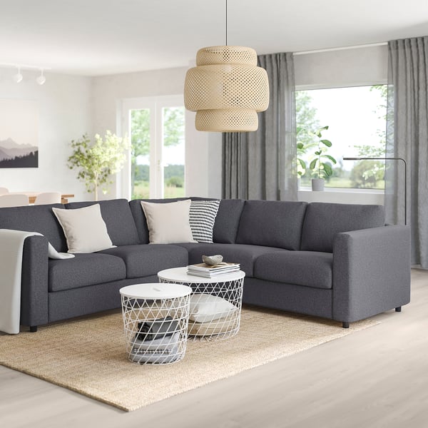 Modern grey VIMLE sectional sofa with white pillows. Large, plush cushions, bigger than side tables. Customizable, stylish design.