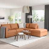 Brown VIMLE sectional, modular with left chaise, ottoman on rug, sunlit living room.