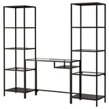 Two modern black metal shelves with glass, one l-shaped.