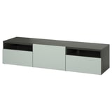 Eine IKEA BESTÅ TV-Bank in Schwarz-Braun mit hellgrauen Schubladen. Es hat ein schlankes, rechteckiges Design mit viel Stauraum.