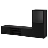 Schwarze BESTÅ TV-Aufbewahrungskombination mit Glasvitrine und Regal, schlankes, modernes Design.