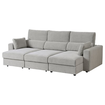 Graues ESKILSTUNA Sofa mit verstellbarer Chaiselongue, hoher Rückenlehne und gepolsterten Kissen.