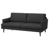 Ein dunkelgraues GRILLSTORP 3-Sitzer-Sofa mit schlankem Design, Holzbeinen und bequemen Kissen.