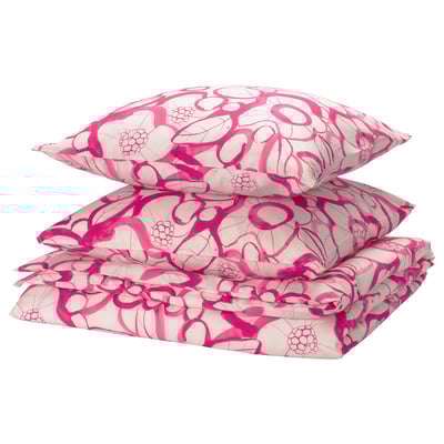 Bettwäsche mit rosa Blumenmuster und Kissen in sanften Rosa- und leuchtenden Rosatönen.