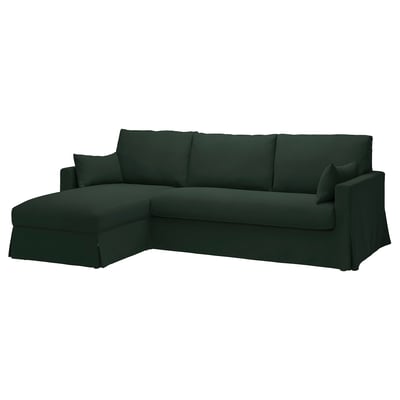 Dunkelgrünes, L-förmiges Sektionssofa mit klaren Linien, weichen Kissen und verdecktem Stauraum unter der Chaiselongue.