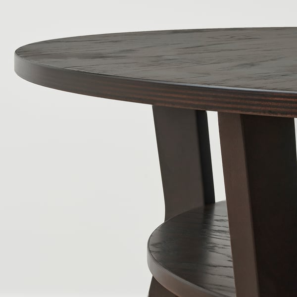 Runder Couchtisch aus Holz mit Birkenbeinen und glatter Platte.