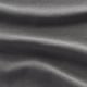 Nahaufnahme eines weichen, glänzenden Stoffes mit feinen, reflektierenden Fäden, der seine strapazierfähige und luxuriöse Textur zur Geltung bringt.