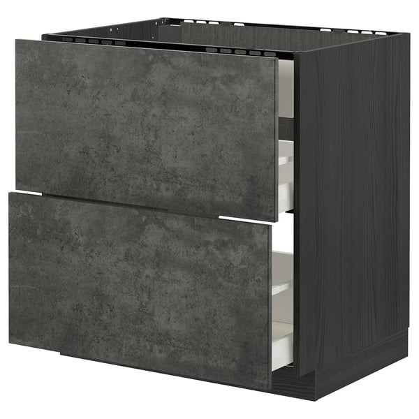 Moderner dunkelgrauer Schubladenschrank aus Beton mit zwei offenen Schubladen. Teil des IKEAS METOD Küchensystems.