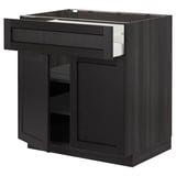 Schwarze METOD-Küchenzeile, dunkles Holzfinish, quadratische Form mit offener Schublade und Schrank.