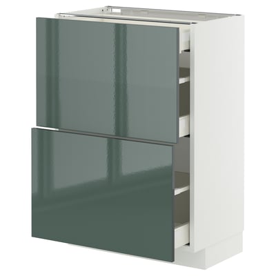 Moderner hochglänzender graugrüner Küchenschrank mit glatten Schubladen.