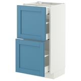 Blau-weißer Küchenschrank mit zwei offenen Schubladen aus Holz und Metall, rechteckige Form.