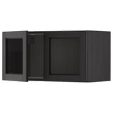 Schwarzer Küchenschrank mit Glastür, Holzrahmen.