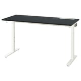 Ein schwarzer höhenverstellbarer Schreibtisch, MITTZON, mit dunkler Platte und weißen Beinen. Das Kabelmanagement und die einstellbaren Höheneinstellungen sorgen für ergonomischen Komfort.
