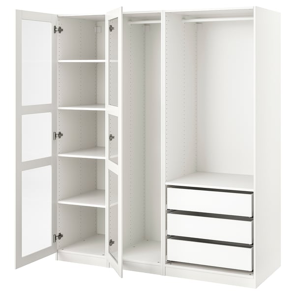 Ein ikea PAX-Kleiderschrank in Weiß mit offenen Türen, die leere Regale und Schubladen freigeben, der für die individuelle Aufbewahrung konzipiert ist.