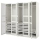 Option: Ein offener weißer Ikea PAX-Kleiderschrank mit mehreren Schubladen und Regalen zur Aufbewahrung.