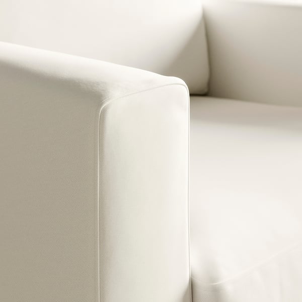 Modernes, minimalistisches weißes Sofa; makelloser Stoff, saubere Linien; bequem, hochwertig.