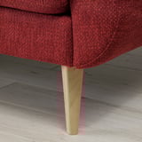 Rotes gepolstertes Sofa mit konischem Holzbein, das modernen Komfort und Retro-Stil zeigt.
