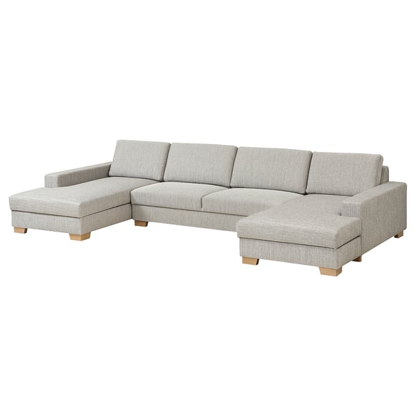 Ein hellgraues, u-förmiges SÖRVALLEN-Sektionssofa mit Holzbeinen. Es bietet ein modernes, minimalistisches Design mit einer bequemen, tiefen Sitzfläche.