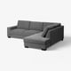 Ein modernes graues SÖRVALLEN-Ecksofa mit minimalistischem Design, mit Chaiselongue und klaren Linien.