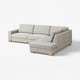 Modernes, l-förmiges graues Sofa, minimalistisches skandinavisches Design, helle Holzfüße.