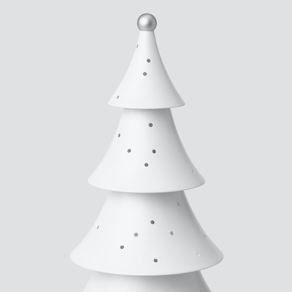 Moderne weiße Baumlampe, drei Stufen mit gepunkteten Löchern, strahlt weiches, leuchtendes Licht aus.
