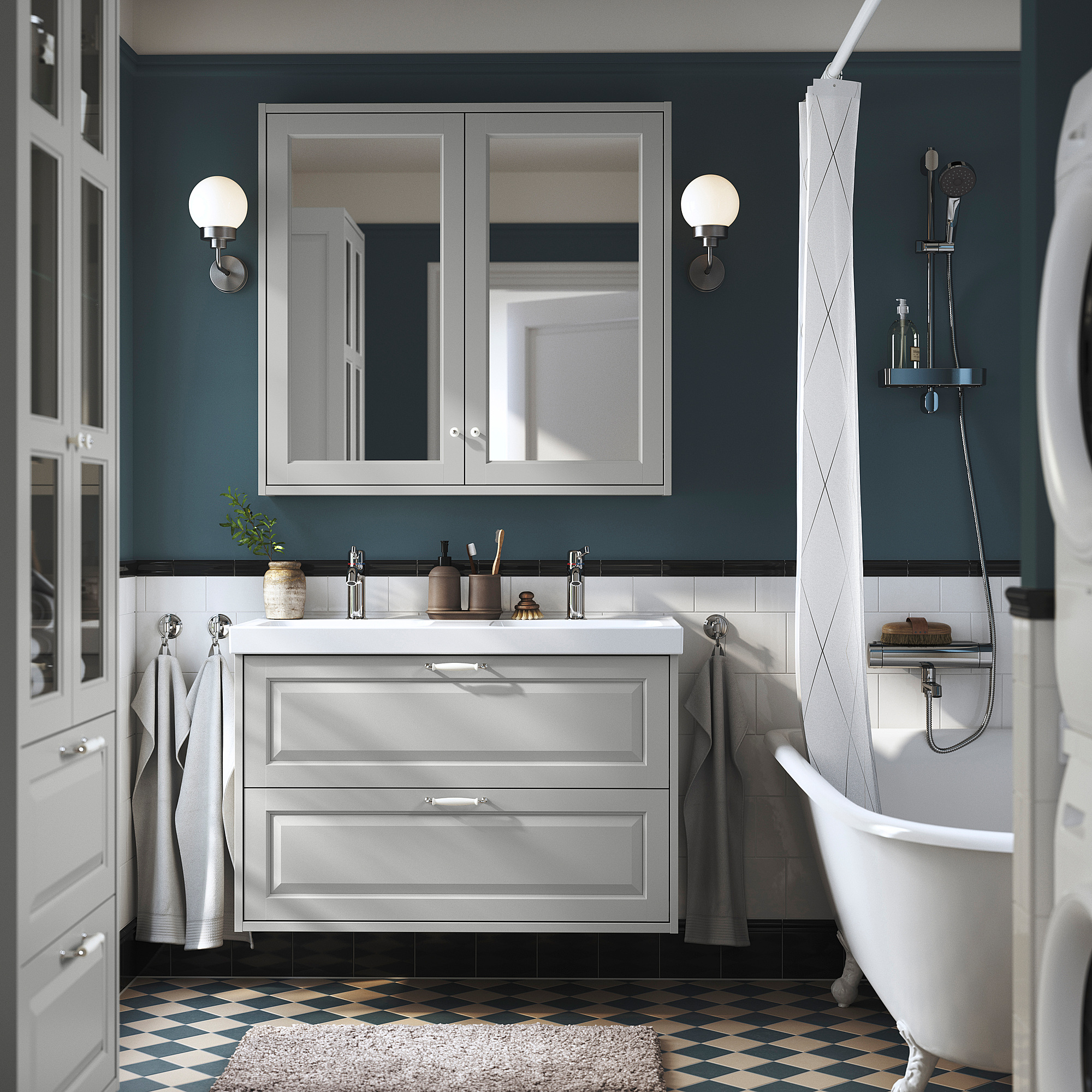 Modernes Badezimmer mit grauem TÄNNFORSEN-Waschtisch, Doppelwaschbecken und dunklen blaugrünen Wänden.