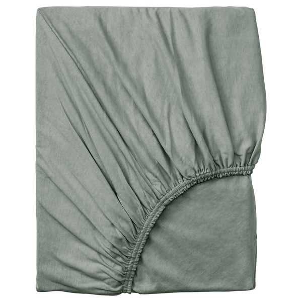 Hellgrünes Spannbetttuch aus VÅRVIAL Baumwolle, quadratische, weiche Jersey-Textur mit elastischen Kanten.