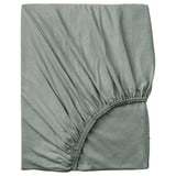 Hellgrünes Spannbetttuch aus VÅRVIAL Baumwolle, quadratische, weiche Jersey-Textur mit elastischen Kanten.