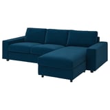Blaues L-förmiges Sofa mit Stauraum, tiefer Sitzfläche und abnehmbarem Bezug.