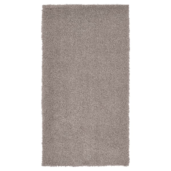 VINDEBÄK Teppich in Grau, zottelige Textur, rechteckige Form.