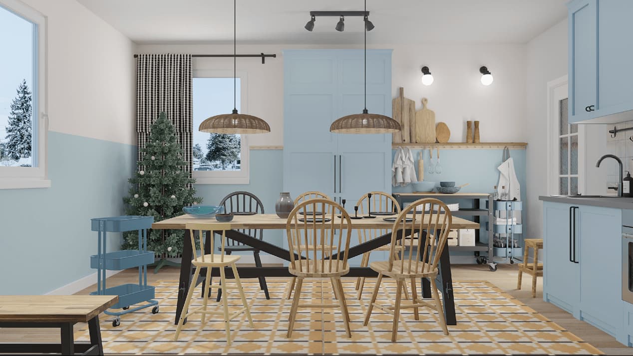 Virtual dining space with a wooden table, chairs, and a patterned rug beside a modern kitchen. A decorated VINTERFINT Christmas tree stands in the corner against light blue walls and cabinets.