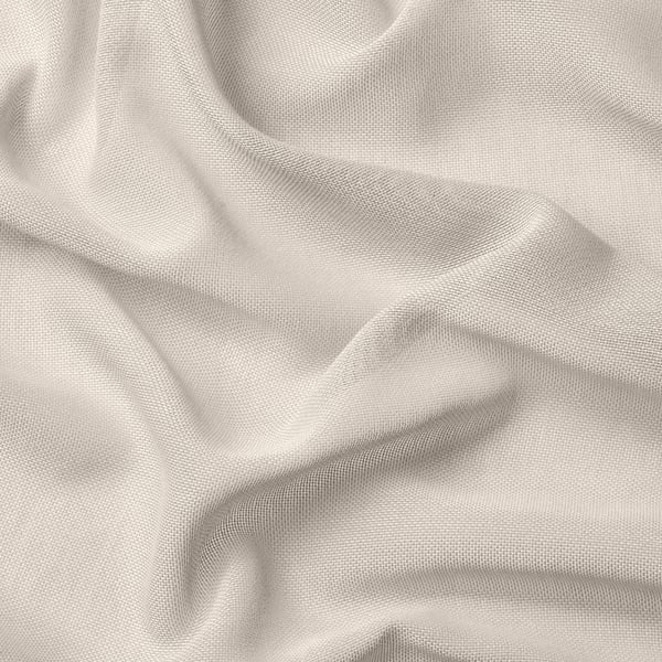 Soft beige sheer curtain fabric, draped elegantly, showcasing delicate weave and light filtering quality.