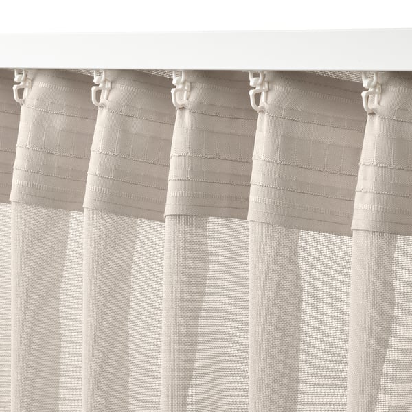 Light beige curtains with hooks; semi-sheer, fits wide windows.