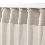 Light beige curtains with hooks; semi-sheer, fits wide windows.