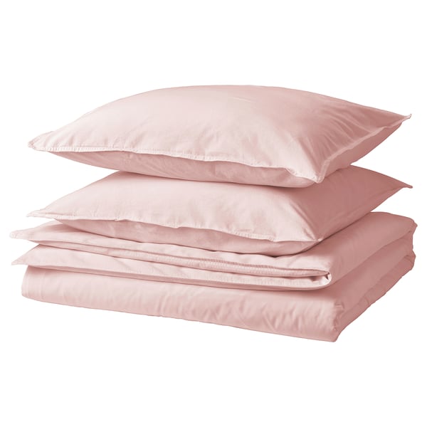 Folded pink cotton bed sheets with two pillows on white background.