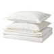 Option: A stack of white cotton bed linens, including a duvet cover and pillowcases, arranged neatly.