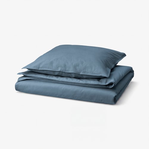 Blue folded duvet cover and pillowcase set of recycled cotton.