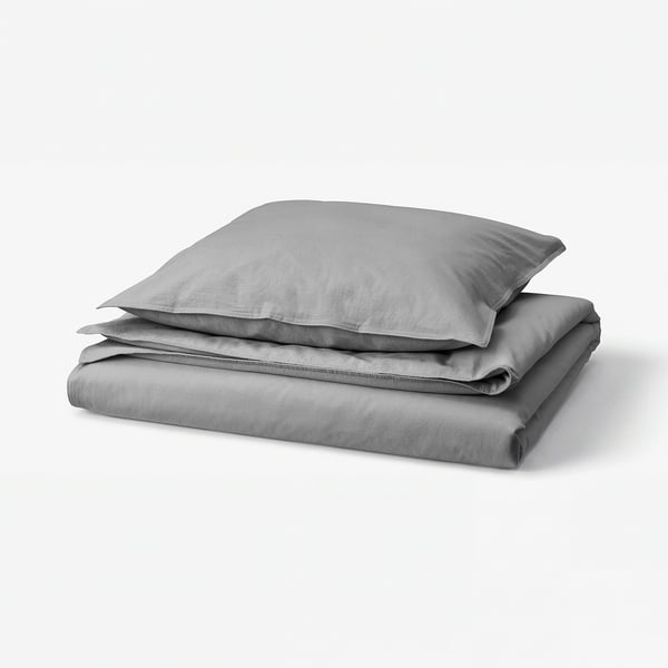 A neatly folded grey duvet set with pillowcase, featuring soft, washed cotton by ÄNGSLILJA.
