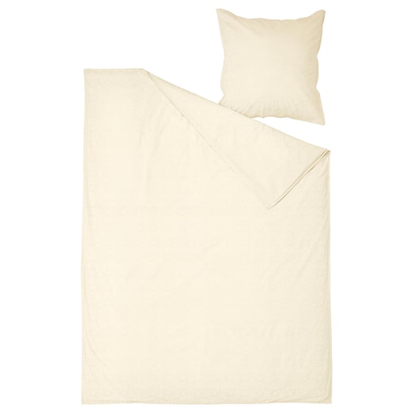 Cream cotton bed set - duvet, pillows, clean edges.
