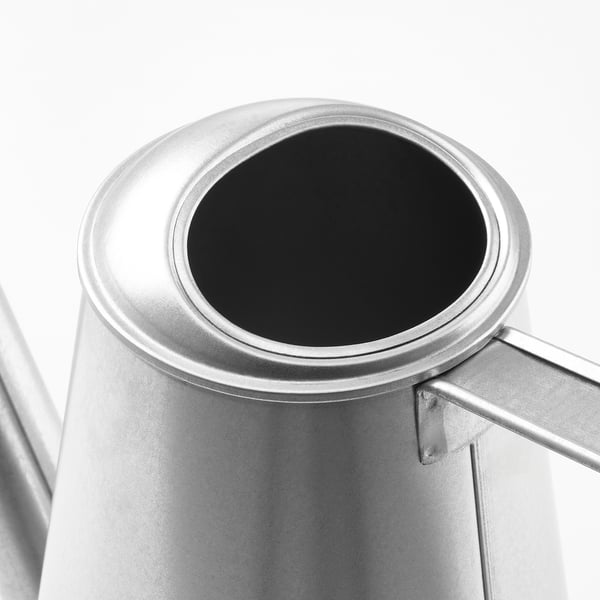 Silver watering can with round opening and handle, showcasing its durable galvanized steel construction.