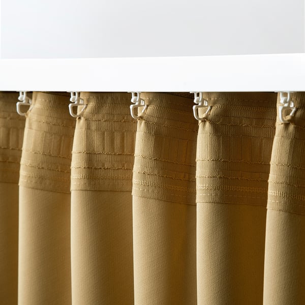 Curtains hung with hooks and tape, blocking light for privacy.