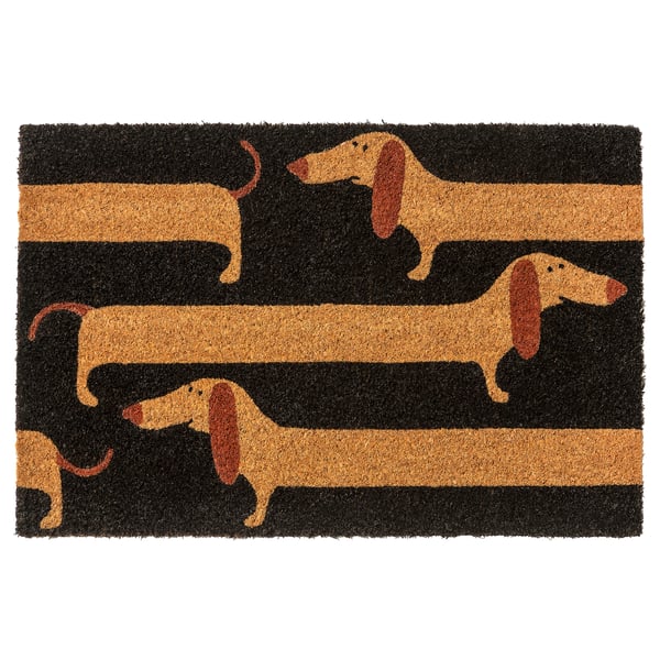 Is of a rectangular, black and tan doormat featuring a playful pattern of brown dachshunds on a striped background, made from coir fiber and jute.