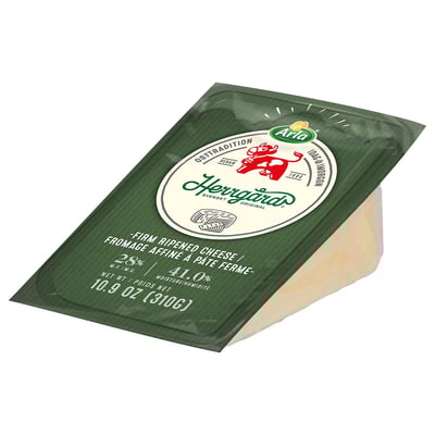 Image depicts a packaged wedge of ARLA HERRGÅRD cheese. The green wrapper displays brand and product information.