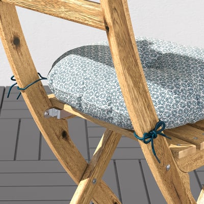 Foldable wooden chair with cushion, ideal for outdoor use.