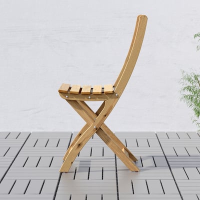 Wooden foldable chair on tiled floor, ready for small spaces. Pre-assembled, durable acacia wood.