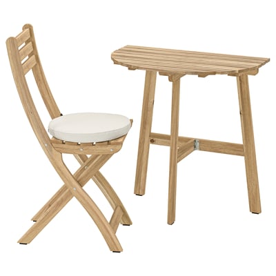 Light brown outdoor table and chair set with cushion.